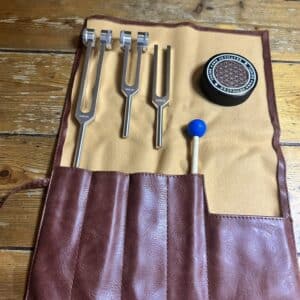 Set of three tuning forks 128 Hz, 256 Hz and 528 Hz with faux leather pouch, applicator puck and striker for sound healing.